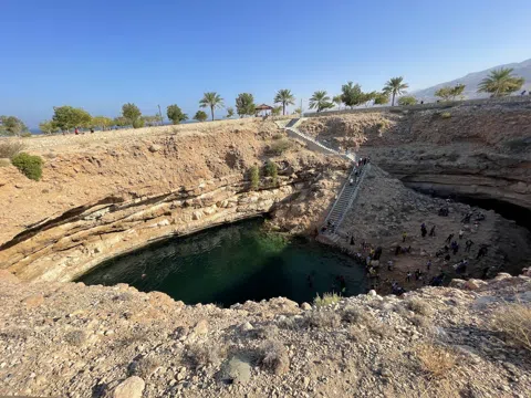 The wadi-and-sinkhole circuit: a cool-water counterpoint to Muscat's desert heat